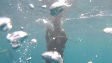 World News | Fish Jumps into Man's Mouth, Wiggling Down His Windpipe