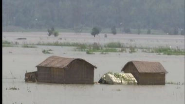 India News | Assam: Flood Victims Take Shelter on Parts of NH-37