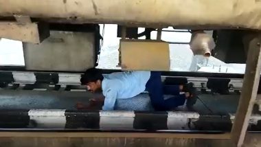 Railway Employee Crawls in Tight Space Beneath Train Stuck On A Bridge To Fix Air-Leakage Issue; Watch Viral Video