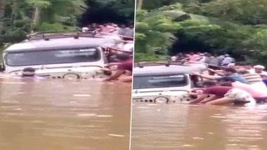 Kerala Rains: Locals Try To Pull Out Jeep Stuck on Inundated Road After Heavy Rains Lash Kannur (Watch Video)