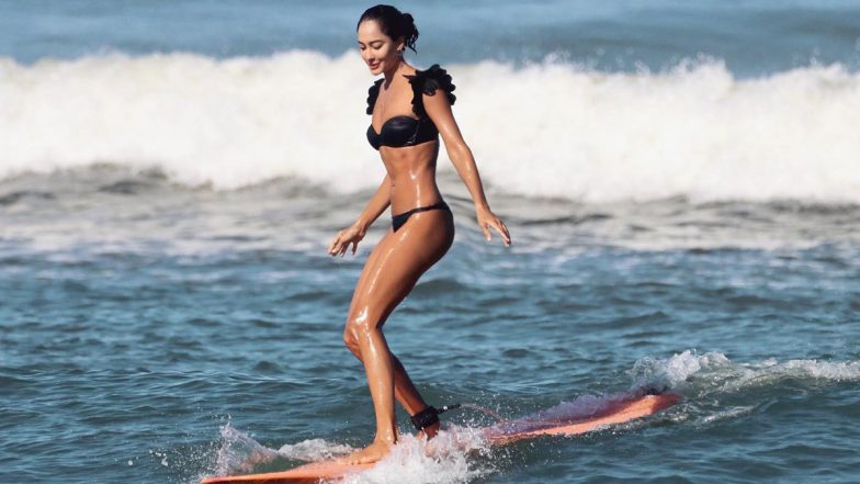 Lisa Haydon Dons a Black Bikini As She Surfs in Bali Flaunting Her Hot Bod (View Pics)