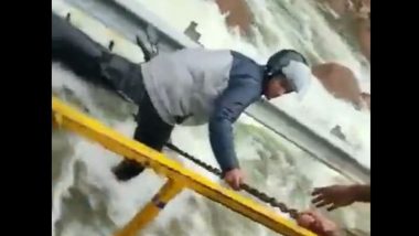 Cyberabad Police Rescue Man Trying to Cross Overflowing Himayath Sagar Service Road Bridge on Bike (Watch Video)