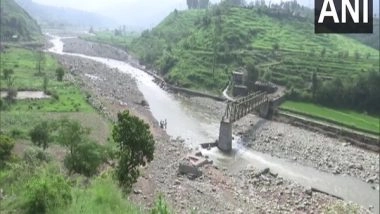 India News | J-K: Heavy Rain, Flash Floods Damage Foot-over Bridge in Rajouri