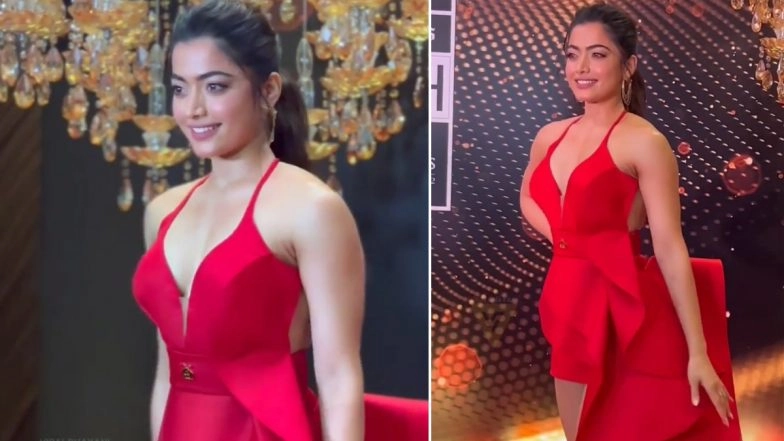 Rashmika Mandanna Looks Stunning in a Red Hot Thigh-High Length Dress, Actress Winks at Paps on the Red Carpet (Watch Video)