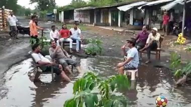 Video of People Drinking and Chilling Out in Water-Logged Potholes in Madhya Pradesh Goes Viral; Netizens Bemused