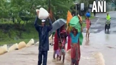India News | Villagers Forced to Carry Children, Belongings on Shoulders as Rain Floods River, Drains in Nashik