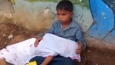 Madhya Pradesh Shocker: 8-Year-Old Boy Sits With Younger Brother’s Body in Lap Outside Hospital As Father Looks for Ambulance in Morena (Watch Video)