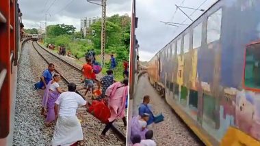 Woman Crosses Railway Track To Collect Luggage Seconds Before Furiously Speeding Train Arrives; Video of Life-Threatening Stunt Goes Viral