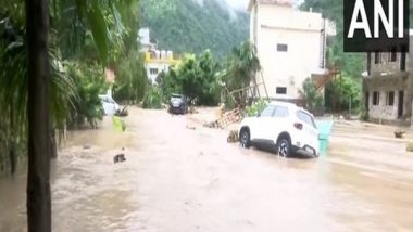 India News | U'khand Cloudburst Aftermath: Heavy Water Flow Damages Roads in Dehradun