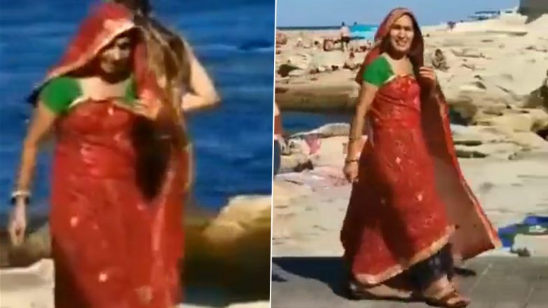 Show-Stopping Saree Moment! Watch Viral Video of Woman Grabbing All the Attention While Strolling on a Foreign Beach in Saree