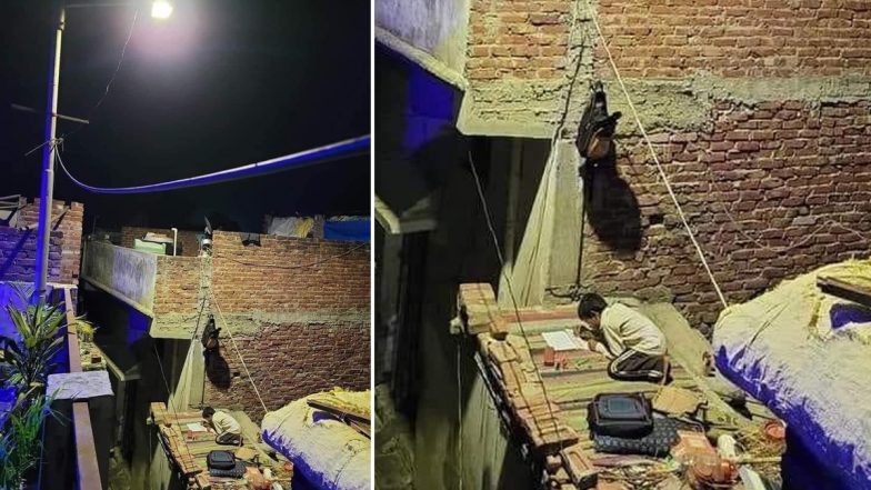 Photo of Kid Studying in Street Light on Roof of Shanty Goes Viral