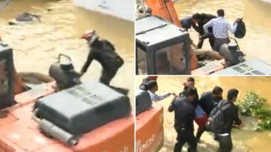 Bengaluru Rains: Security Guards Recuse Man After He Gets Stuck on a Waterlogged Street in Bangalore (Watch Video)