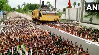 Andhra Pradesh: Illegal Liquor Worth Rs 5.47 Crore Destroyed By Road Roller in Nandigama (Watch Video)