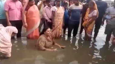 Video: Jharkhand Congress MLA Deepika Pandey Singh Sits in Waterlogged NH 133, Takes Symbolic Bath To Protest Poor Road Quality