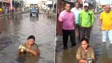 Jharkhand Congress MLA Deepika Pandey Singh Sits in Pool of Muddy Water, Protests Against ‘Poor’ Condition of National Highway in Godda (Watch Video)
