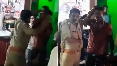 UP Shocker: Policeman Brutally Thrashes Youth For Trying to Defuse Tension Between Man Performing Stunts on Bike And Cop in Jhansi, Video Goes Viral