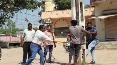 Gujarat Public Flogging Video: Youths Accused of Attacking Garba Event Tied to Pole, Thrashed With Sticks by Kheda Police As Villagers Cheer