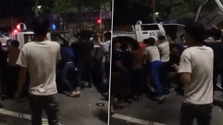 China: Stay-at-Home Order To Contain COVID-19 Spread Sparks Unrest in Guangzhou, Protesters Overturn Police Car, Tear Down Barricades (Watch Videos)