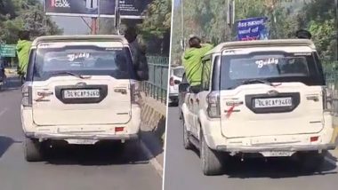 Viral Video: Youths Perform Stunts by Leaning Out of Moving Car in UP's Meerut