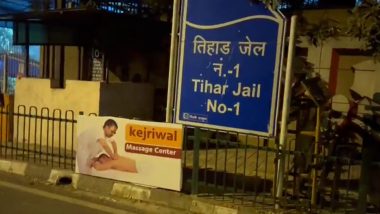 'Kejriwal Massage Centre' Posters Turn Up Outside Tihar Jail After Reports of Jailed Minister Satyendar Jain Getting VIP Treatment Surfaced, BJP Takes Dig (Video)