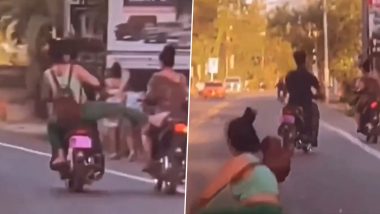 Viral Video: Woman Loses Balance And Falls Off Scooty While Trying to Kick Rider