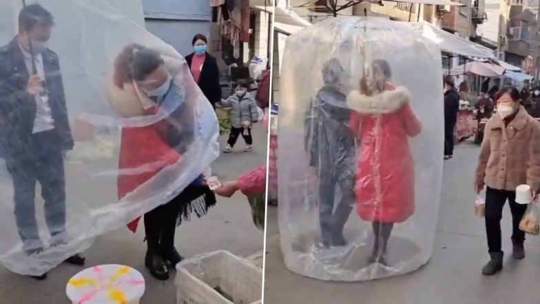 Video of Chinese Couple Shopping for Groceries With a Protective Plastic Sheet Goes Viral; Internet Loves the New Hack Amid COVID-19 Outbreak