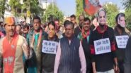 India News | Rajasthan BJP Stages Unique Protest in Udaipur Wearing Masks of Rajasthan Ministers