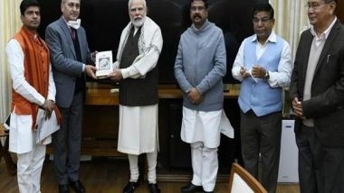 India News | Dharmendra Pradhan Presents Book Titled 'India: The Mother of Democracy' to PM Modi