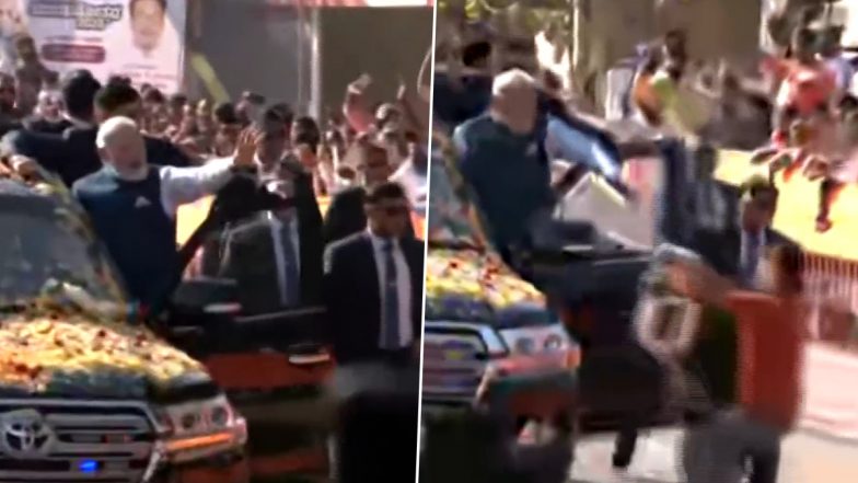 PM Narendra Modi Security Cover Breach Video: Man Reaches Near Prime Minister's Car With Garland During Roadshow in Hubballi, Pulled Away by Cops