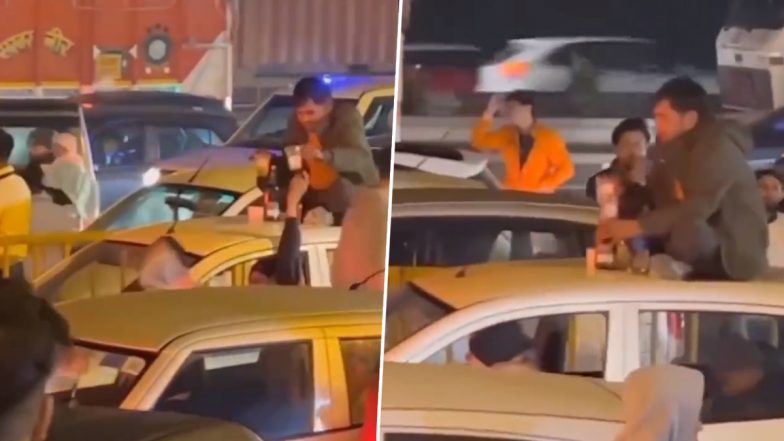 Gurugram: Man Seen Drinking on Car’s Roof Amid Traffic Jam, Video Goes Viral