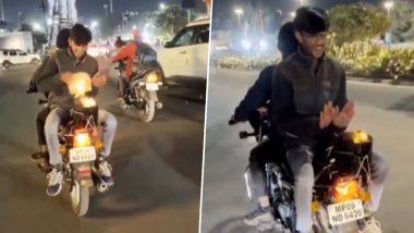 Madhya Pradesh: Youth Riding Pillion on Bike Warms His Hands With Portable Bonfire Tied on The Vehicle, Booked After Video Goes Viral