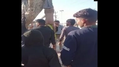 India News | Video Shows People Hanging Man Upside Down from Tree, Beating Him for Pelting Stones at Temple in Rajasthan