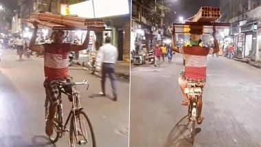 Viral Video: Man Rides Bicycle Holding Weight on His Head With Both Hands
