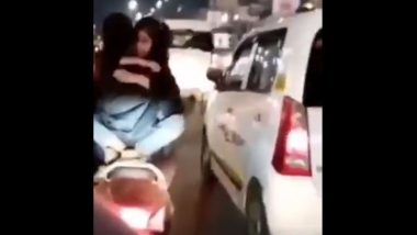 PDA on Two-Wheeler: Youth Arrested for Romancing on Running Scooty in Lucknow, Watch Viral Video