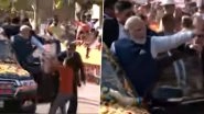 PM Narendra Modi Security Lapse: Man Breaches Security Cover During Prime Minister's Roadshow in Hubballi, Runs to Him With Garland (Watch Video)