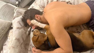 Varun Dhawan Shares Adorable Photo Cuddling with His Dog Joey While Shirtless! (View Pic)