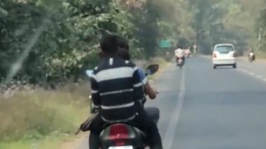 Uttar Pradesh: Video of Couple Romancing on Moving Bike in Amroha Goes Viral, Cops Launch Probe