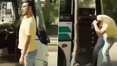 Man Hangs Out on Door of a Moving Bus While Shouting Out Loud, Instant Karma Gets Best of Him (Watch Video)