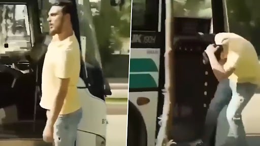 Man Hangs Out on Door of a Moving Bus While Shouting Out Loud, Instant Karma Gets Best of Him (Watch Video)