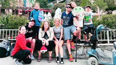 Jeremy Renner Uses a Motorized Scooter in New Photo with Fam at Six Flags Theme Park (View Pic)