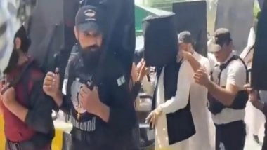 World News | Imran Khan Walks into Court with Bulletproof Helmet, Human Shields in Lahore