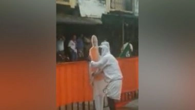 India News | Karnataka Man Wipes Rainwater from Cutouts of PM Modi in Devanahalli