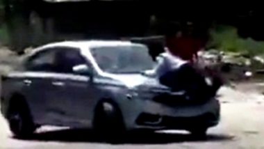 Ludhiana Shocker: Car Driver on Phone Drags Punjab Traffic Police Constable on Bonnet After Trying To Run Over Him, Case of Attempt to Murder Registered (Watch Video)