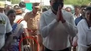 Tamil Nadu District Collector Sravan Kumar Jatavath Comes Under Fire After Video of Assistant Carrying His Shoes at the Koothandavar Temple Goes Viral