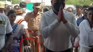 Tamil Nadu District Collector Sravan Kumar Jatavath Comes Under Fire After Video of Assistant Carrying His Shoes at the Koothandavar Temple Goes Viral