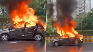 Uttar Pradesh Car Fire: Burning Car Thriller on Noida Road, Couple Jumps Out of Vehicle To Save Self (Watch Video)