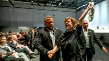 Activists Throw Cake Amid Protest at Volkswagen Meeting