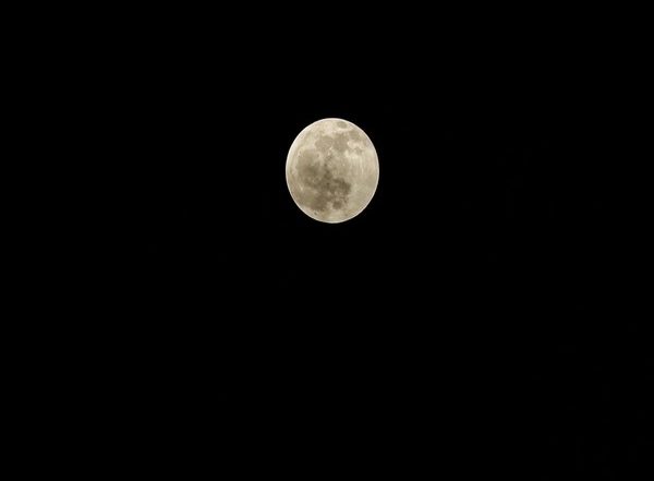 Penumbral Lunar Eclipse Seen Over Nepal Sky on Full Moon Day