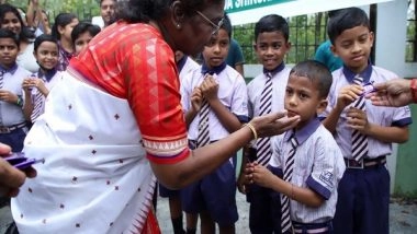 India News | President Murmu Gets Down from Vehicle Midway, Gives Chocolates to Children in Odisha