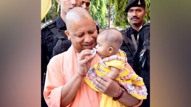 Heart-Touching! UP CM Yogi Adityanath Performs 'Annaprashan' Ritual for Daughter of Divyang Sweeper in Gorakhpur (View Pic)